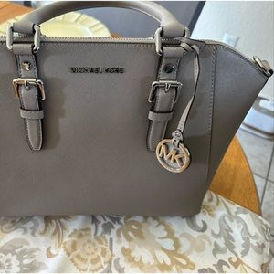 Michael korks  , basically new I never used honestly , is in perfect condition